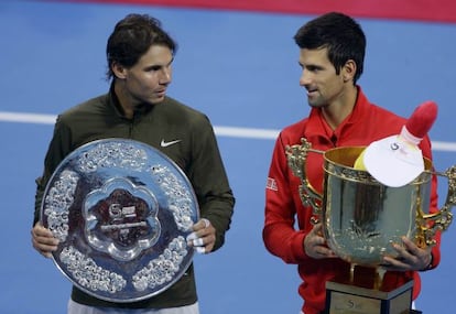 Spain&#039;s Rafael Nadal (l) and Novak Djokovic of Serbia pose with their trophies after their men&#039;s singles final match at the China Open.