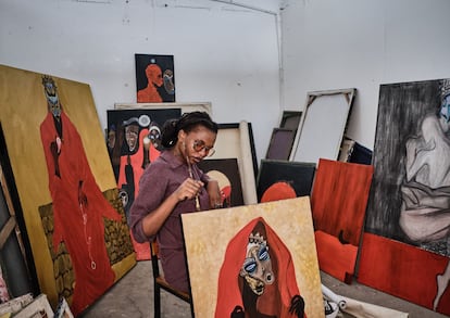 The artist Sabi John with some of her pieces exhibited in Nafasi, on April 17.