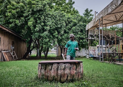 Lazaro Samwel, Tanzanian artist, works on one of his pieces in the Nafasi courtyard, on April 10.