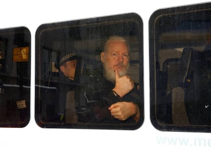 Julian Assange inside a police van after his arrest on April 11.