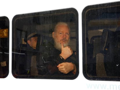 Julian Assange inside a police van after his arrest on April 11.