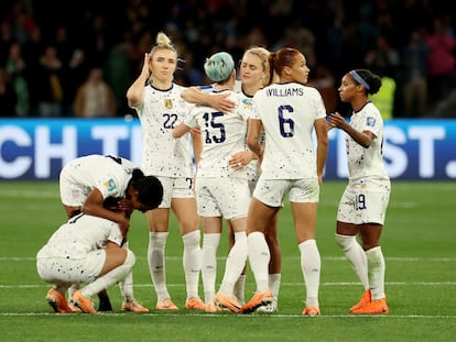 Kristie Mewis of the U.S. and teammates look dejected as the are knocked out of the World Cup.