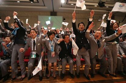 The Tokyo delegation jumps for joy as their successful bid to host the 2020 games is announced. 