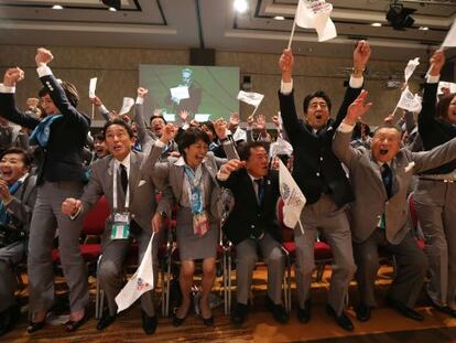 The Tokyo delegation jumps for joy as their successful bid to host the 2020 games is announced. 