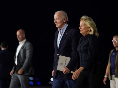 U.S. President Joe Biden and first lady Jill Biden walk from Air Force One upon their arrival in Reno, Nevada, U.S., August 18, 2023.