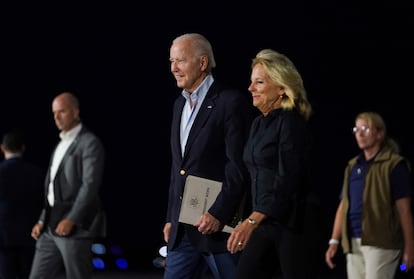 U.S. President Joe Biden and first lady Jill Biden walk from Air Force One upon their arrival in Reno, Nevada, U.S., August 18, 2023.