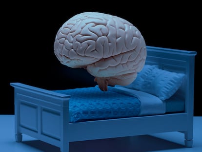Model of human brain floating over bed in dark room