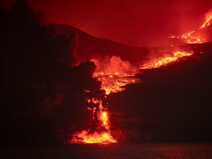 The lava from the volcano reaches the sea.