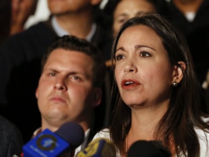 Opposition Deputy María Corina Machado speaks to reporters.