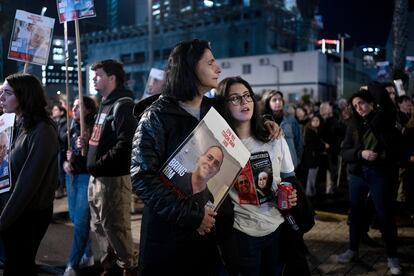 Women listen to a speaker during a weekly rally calling for the release of hostages who were kidnapped on Oct. 7, 2023, in Tel Aviv, Israel, Saturday, Feb. 3, 2024