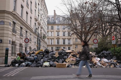 This photograph taken on March 13 in Paris, 2023, shows waste that has been piling up on the pavement as waste collectors are on strike since March 6 against the French government's proposed pensions reform.