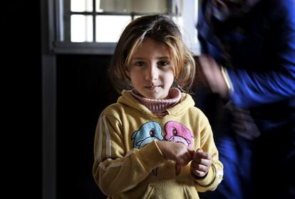 In this Monday, March 7, 2016 photo, Tala al-Faouri, 5, poses for a picture inside her family's shelter in the Zaatari Refugee Camp, near Mafraq, Jordan. Just two weeks after the Syrian conflict started, Tala was born in the southern province of Daraa, where the Syrian conflict originated, on March 28, 2011.  Her mother Doaa dreams of returning and raising Tala in Syria. x93We were not rich, but we were not poor. We lived a fine life. God willing, she will live like we once did. We donx92t want more, or less, than that,x94 she says. (AP Photo/Raad Adayleh)