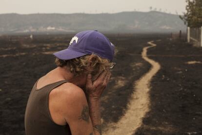 Robert Hooper, exhausted after several days with little sleep, is overcome with emotion while surveying his property that was burnt by the so-called Valley Fire near Middleton, California September 14, 2015. The Northern California wildfire ranked as the most destructive to hit the drought-stricken U.S. West this year has claimed one life and burned at least 400 homes to the ground, fire officials reported on Monday, saying they expected the property toll to climb. REUTERS/David Ryder TPX IMAGES OF THE DAY