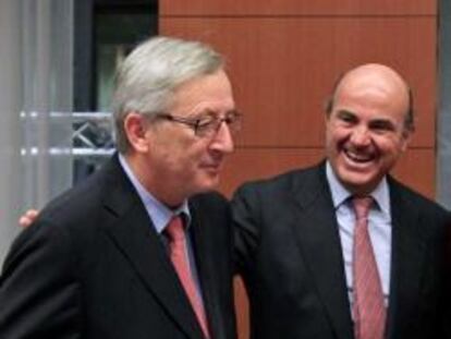 El ministro de Economía español, Luis de Guindos, el primer ministro de Luxemburgo y presidente del Eurogrupo, Jean-Claude Juncker y la directora gerente del FMI, Christine Lagarde, durante la reunión del Eurogrupo