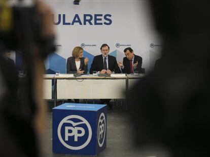 Rajoy, Cospedal y Maillo, este lunes en un acto del PP.