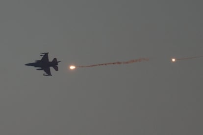 An Israeli fighter jet flies over the Gaza Strip on Tuesday.