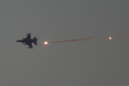 An Israeli fighter jet flies over the Gaza Strip on Tuesday.