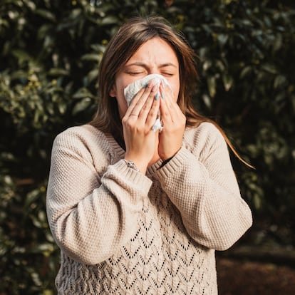 adult woman in the nature suffering allergy