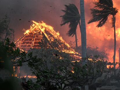 The hall of historic Waiola Church in Lahaina and nearby Lahaina Hongwanji Mission are engulfed in flames along Wainee Street on Aug. 8, 2023, in Lahaina, Hawaii.