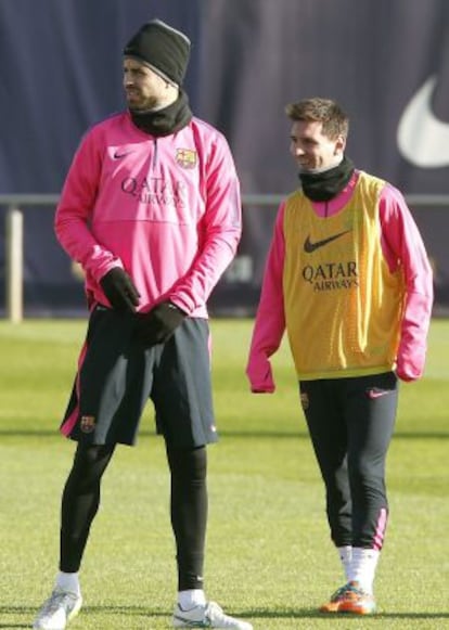 Piqué y Messi, en la sesión de ayer.