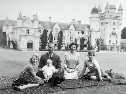 Queen Elizabeth II and Prince Philip, Duke of Edinburgh with their children, Prince Andrew (centre), Princess Anne (left) and Charles, Prince of Wales sitting on a picnic rug outside Balmoral Castle in Scotland, 8th September 1960.