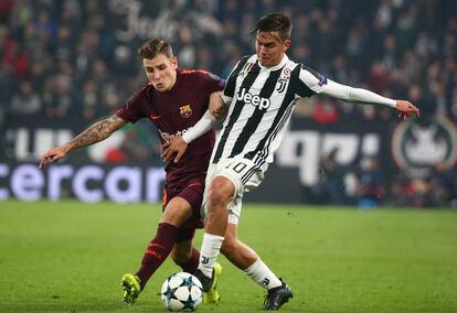 Paulo Dybala del Juventus y Lucas Dignedel Barcelona.     