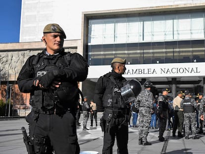 Security forces stand guard outside the National Assembly in Quito after Ecuador's President Guillermo Lasso issued a decree dissolving the legislature, on May 17, 2023.