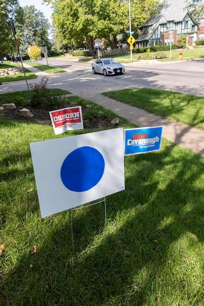 Blue-dot sign in support of Democrats, in an Omaha yard.