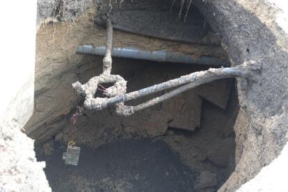 Pipes exposed by the caving in of the tunnel.