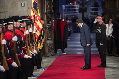 New Catalan premier Carles Puigdemont walks into the Palau de la Generalitat.