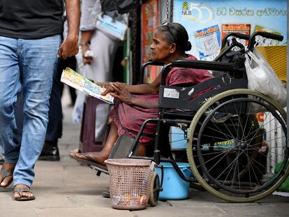 A woman sells lottery tickets in Colombo, Sri Lanka, in August 2022.
