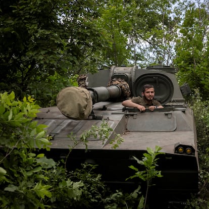 Anton, the commander of an artillery battery climbs out of a 122mm self-propelled Soviet-made Gvozdika howitzers in the Kharkiv region, amid Russia’s attack on Ukraine, Ukraine, May 20, 2024.  REUTERS/Thomas Peter