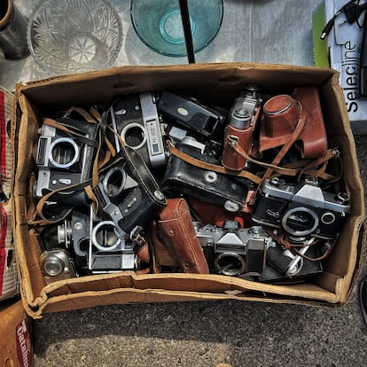 Some stalls carefully displaying Soviet-made cameras, many of which are copies of Germany's legendary Leica. Others have cameras end up thrown away in cardboard boxes like this one.