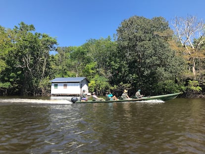 Tourists on a canoe trip organized by the Uakari 'ecohotel' through the Mamirauá reserve, in Brazil's Amazon rainforest.