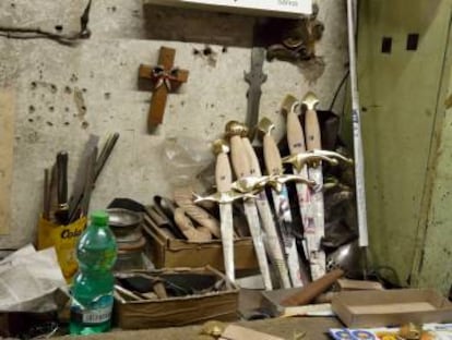 Pommels being fitted onto daggers in the workshop.