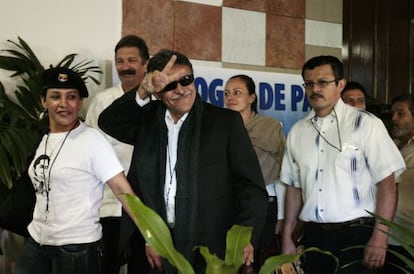 FARC negotiator Jes&uacute;s Santrich gestures as he follows Dutch-born rebel Tanja Nijmeijer on Tuesday.
 