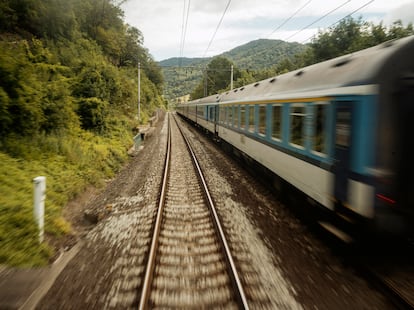 A train runs through Germany, near the border with the Czech Republic.