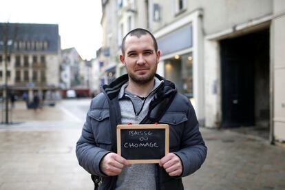 Nicolas Leroy, 29, a commercial employee, holds a blackboard with the phrase "baisse du chomage" (lowering unemployment), the most important election issue for him, as he poses for Reuters in Chartres, France February 1, 2017. He said: "The most important thing in our society is jobs. If you have one, you're alright. If you don't, you're in deep trouble." REUTERS/Stephane Mahe SEARCH "ELECTION CHARTRES" FOR THIS STORY. SEARCH "THE WIDER IMAGE" FOR ALL STORIES