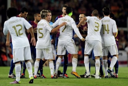 Barcelona and Real Madrid players square up during the Supercup.