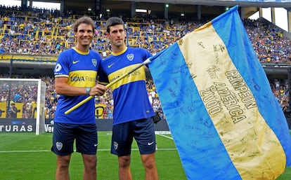 Nadal y Djokovic, durante una visita a la Bombonera del Boca Juniors en 2013.