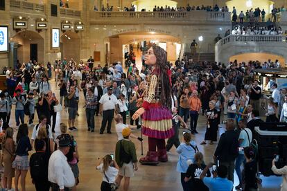 A 12-foot puppet of a 10-year-old Syrian refuge named Little Amal walks around Grand Central Station in New York