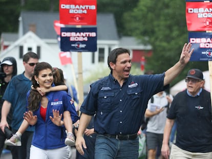 Republican presidential candidate and Florida Gov. Ron DeSantis and his wife Casey, walk in the July 4th parade, Tuesday, July 4, 2023, in Merrimack, N.H.