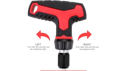 Screwdriver with carraca on white background.