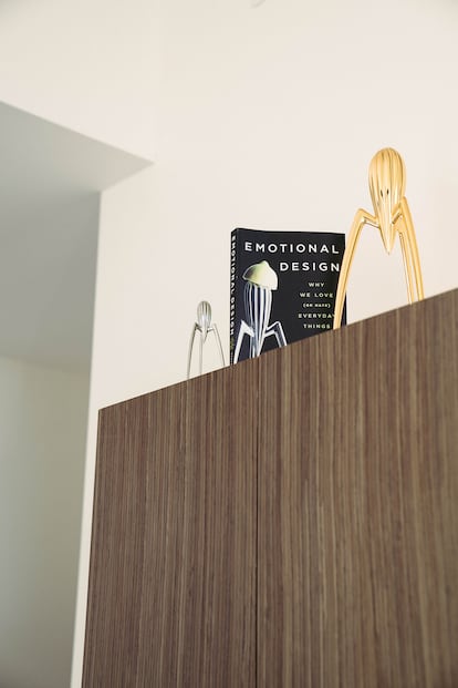 A copy of Don Norman’s book ‘Emotional Design’ in his kitchen, alongside Phillipe Starck’s famous citrus squeezer.