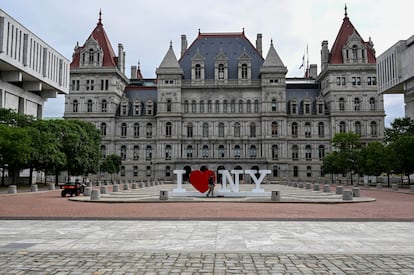 A maintenance worker cleans a sign outside the New York state Capitol as Assembly members return Tuesday, June 20, 2023, in Albany, N.Y.