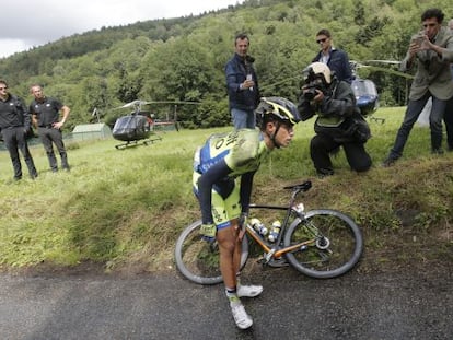 Contador holds his knee after crashing on Monday.