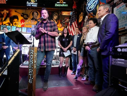 Country music star Luke Bryan speaks during a bill signing ceremony with Gov. Bill, right, on Thursday, March 21, 2024, in Nashville, Tenn.