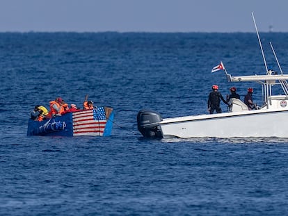 A raft painted with a United States flag is intercepted by the Cuban Coast Guard off the Malecón in Havana.