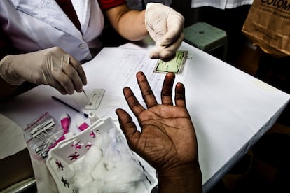 A person takes a rapid HIV test during a campaign in Brasilia.