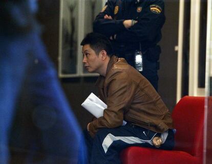 Gao Ping, pictured during the police raid on his Madrid art gallery last week.